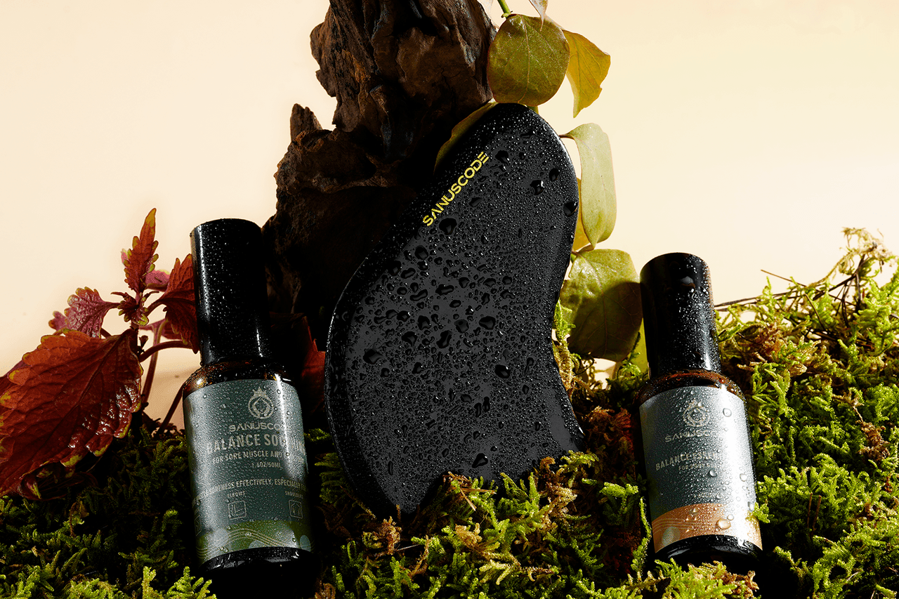 50ml skin oil and black obsidian gua sha stone kit stand on moss