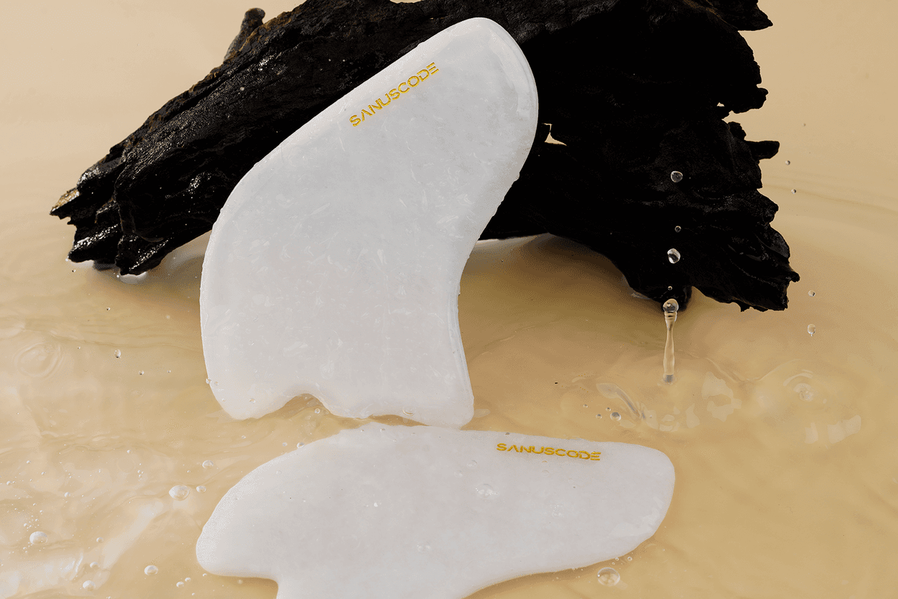 two pieces white jade body gua sha tools side to sandalwood in water