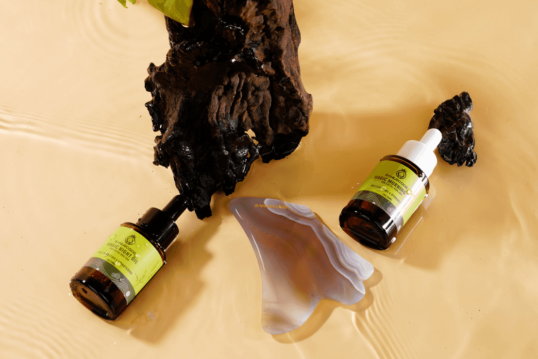 agate gua sha stone and facial oil kit side to the sandalwood in the water
